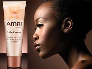 african american woman using a fade cream